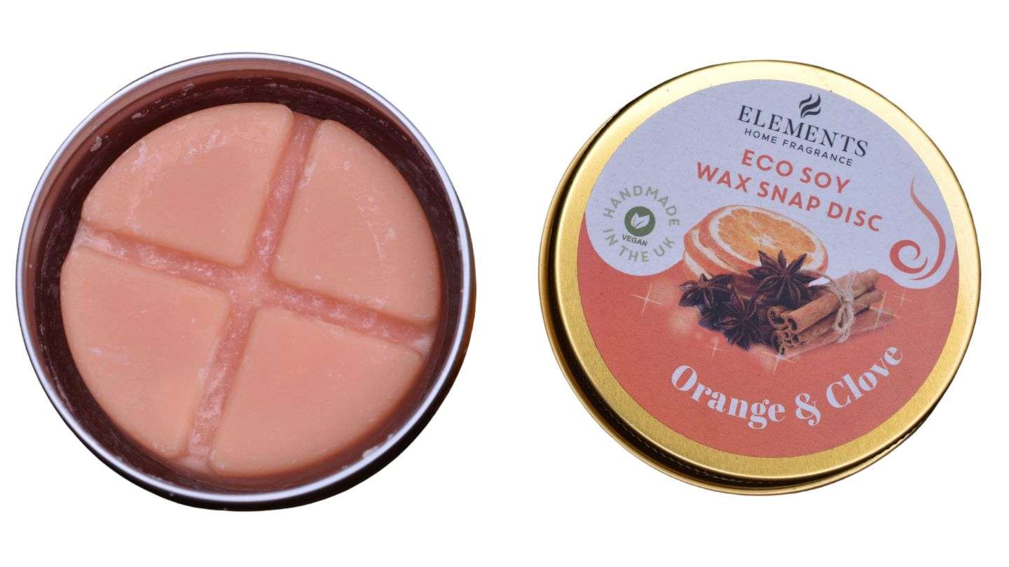 Duftvoks som luker appelsin og nelikk