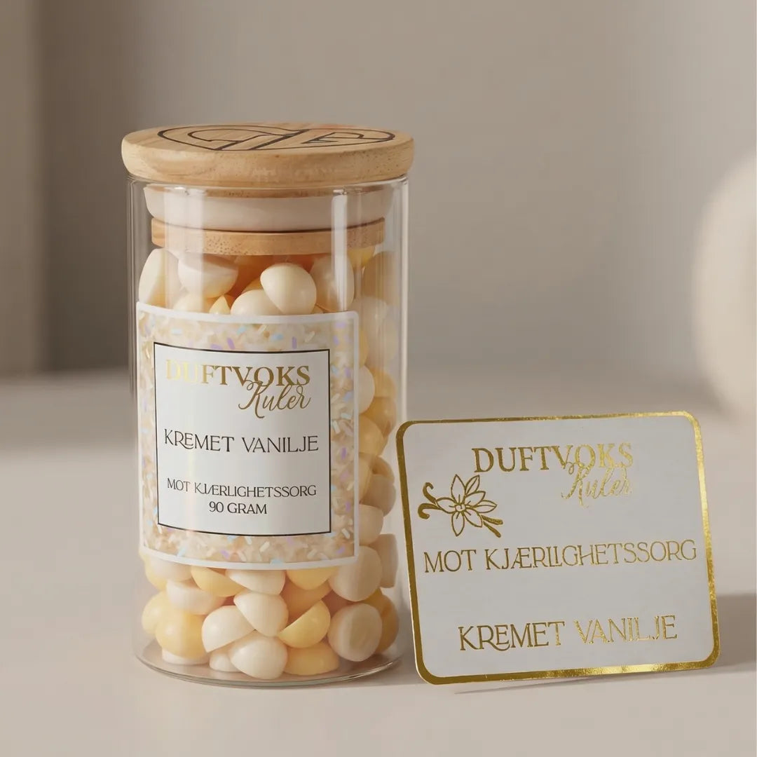 Duftoks kuler med lukten av kremet vanilje. Duftvoks kulene fyller huset med en søt og deilig lukt ved å smelte noen kuler i duftvoks brenneren din. Disse kulene er i fargen kremhvit og gul og vi håper de kan hjelpe noen med kjærlighetssorg i en vanskelig periode. Det følger derfor med duftvokskort med noen ord om kjærlighetssorg.