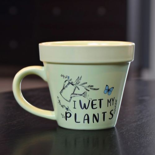 Grønn kaffekopp til plante-eskeren med humor.