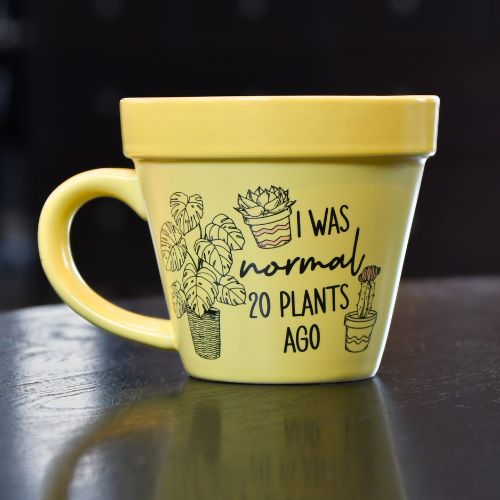 Plantekrus forran. Morsom tekst og bilder av planter. Koppen ser ut som en blomsterpotte.