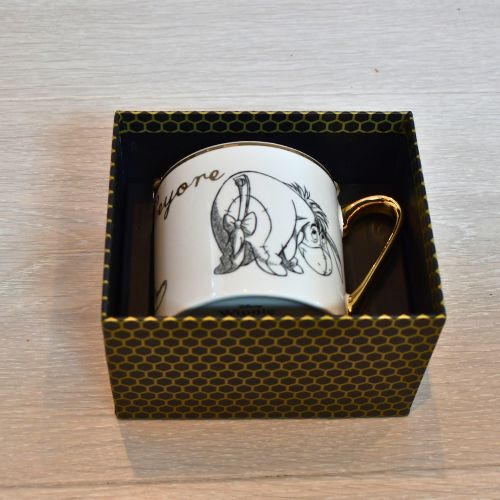 Disney krus i gave eske. Gull og svart eske.