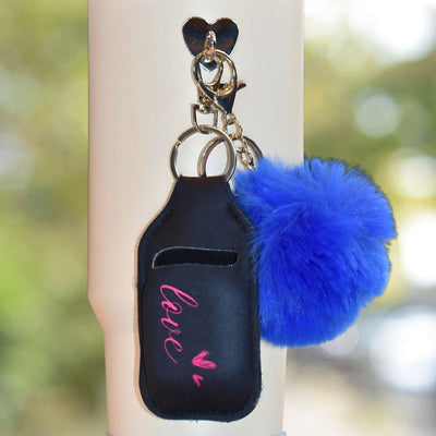 Svart love veske til airpods som henger på termokoppen. 