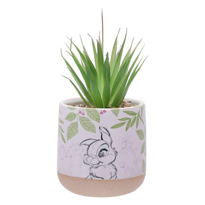 Potteplante med kunstig grønn blomst fra Disney. Bilde av Trampe utenpå. Steiner oppi potten med en plante. Settet kommer med en stor og en liten blomster potte med plante i. 