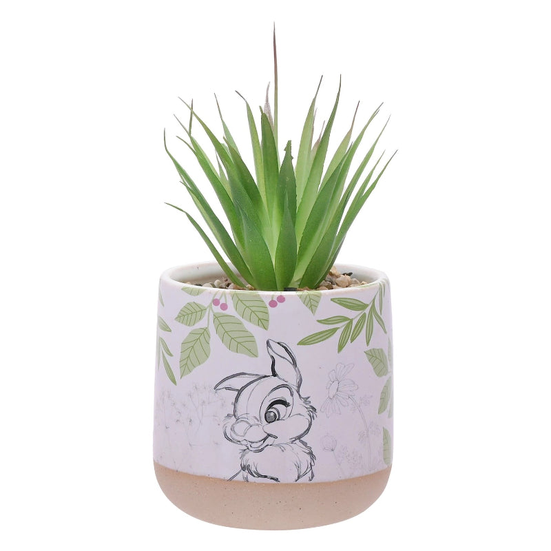 Potteplante med kunstig grønn blomst fra Disney. Bilde av Trampe utenpå. Steiner oppi potten med en plante. Settet kommer med en stor og en liten blomster potte med plante i. 